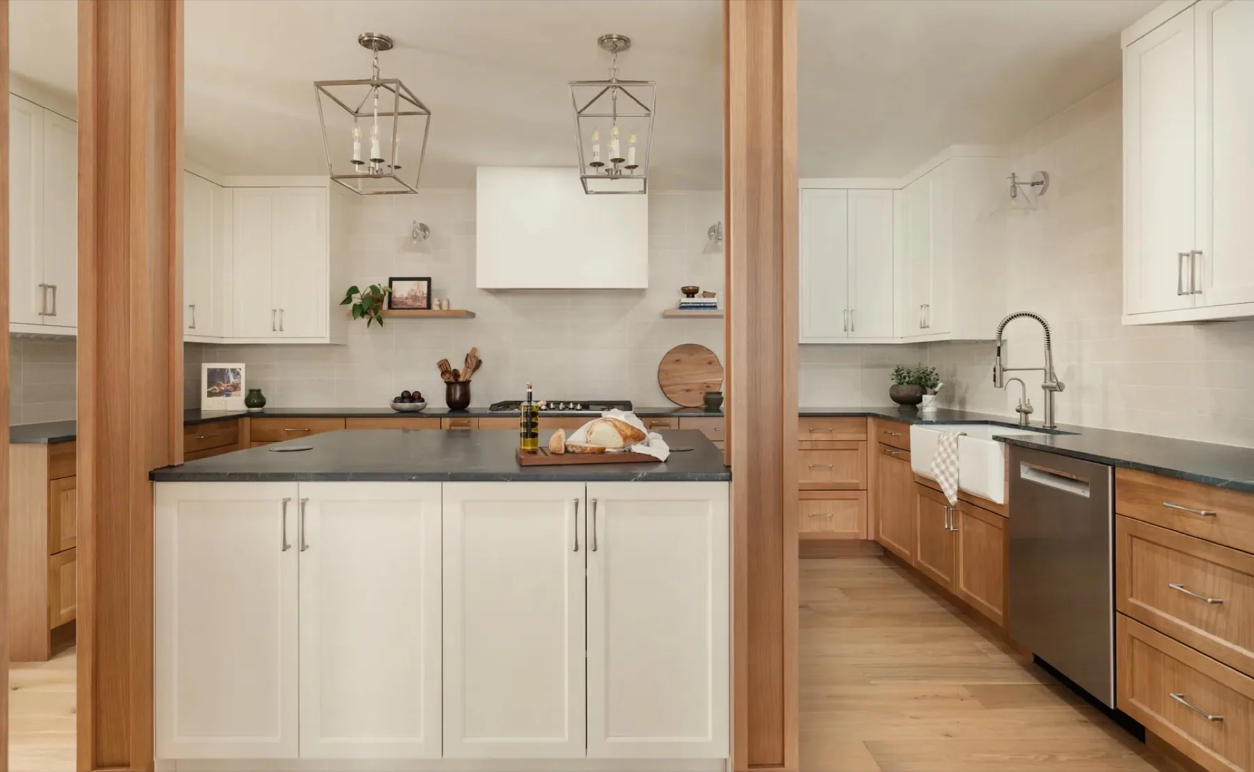 Rusty Fig Residence kitchen with warm rift-cut oak and creamy white shaker doors